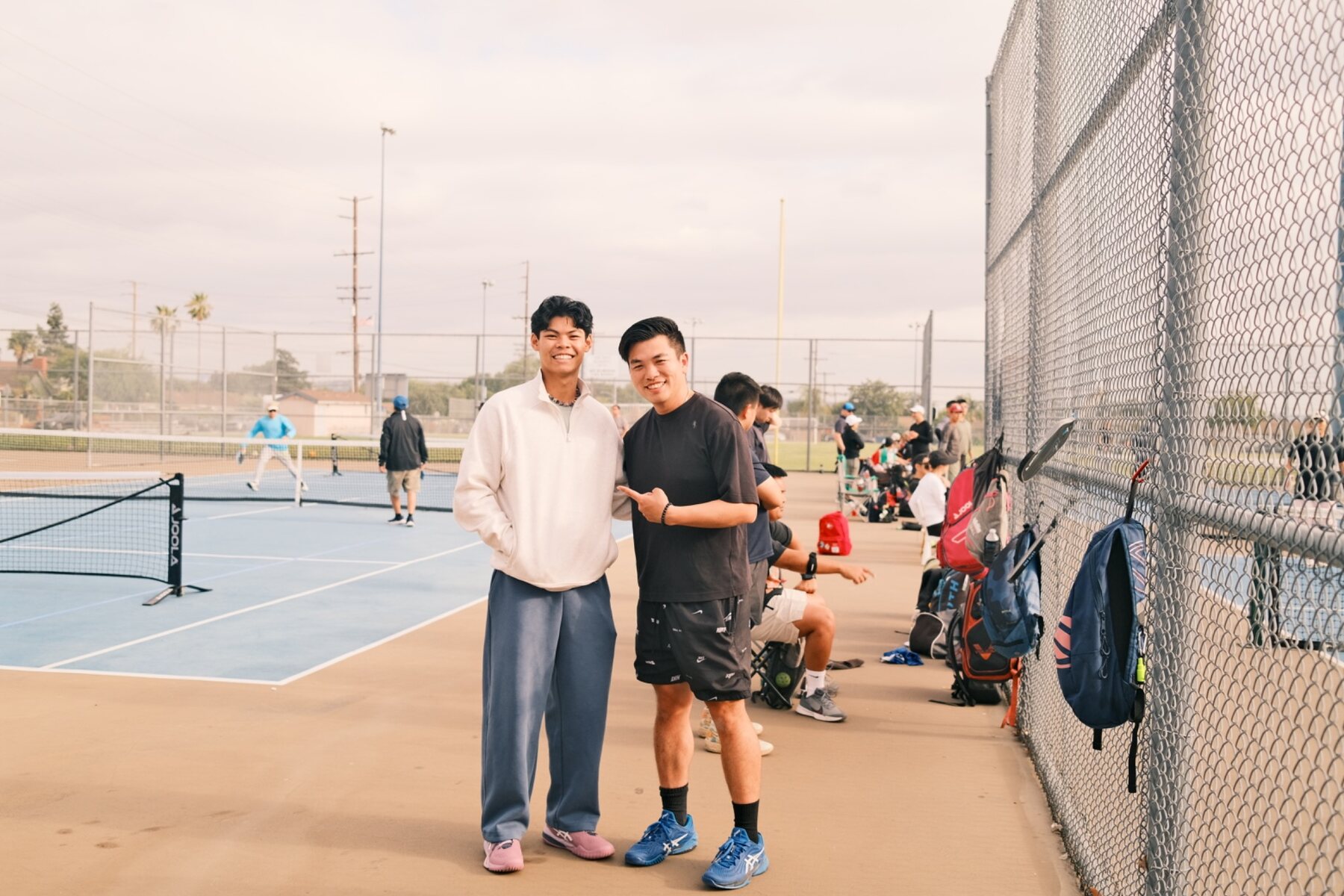 Eric Ng welcoming an athlete at a community pickleball event