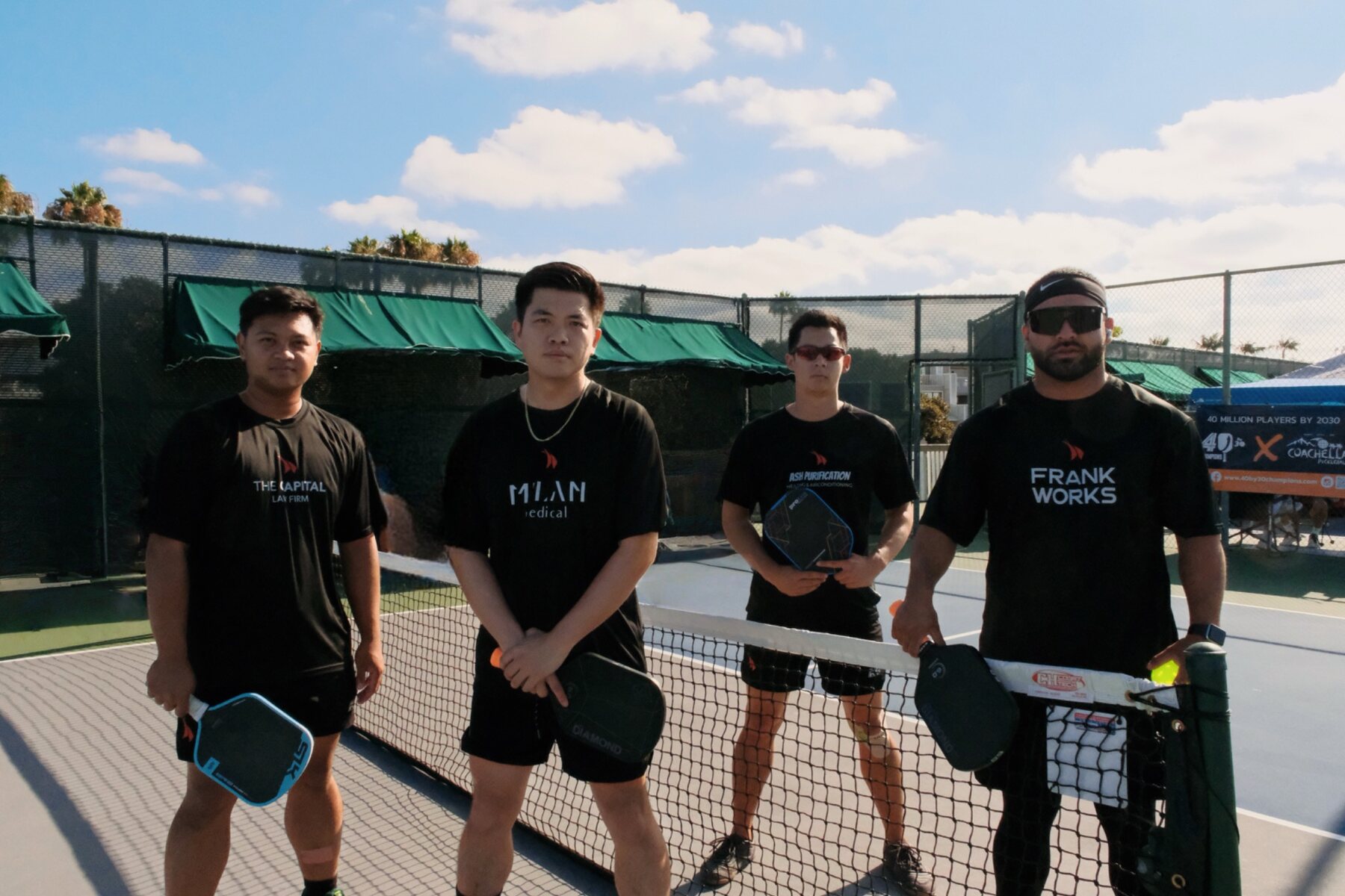 Competitive pickleball team gathered at the net