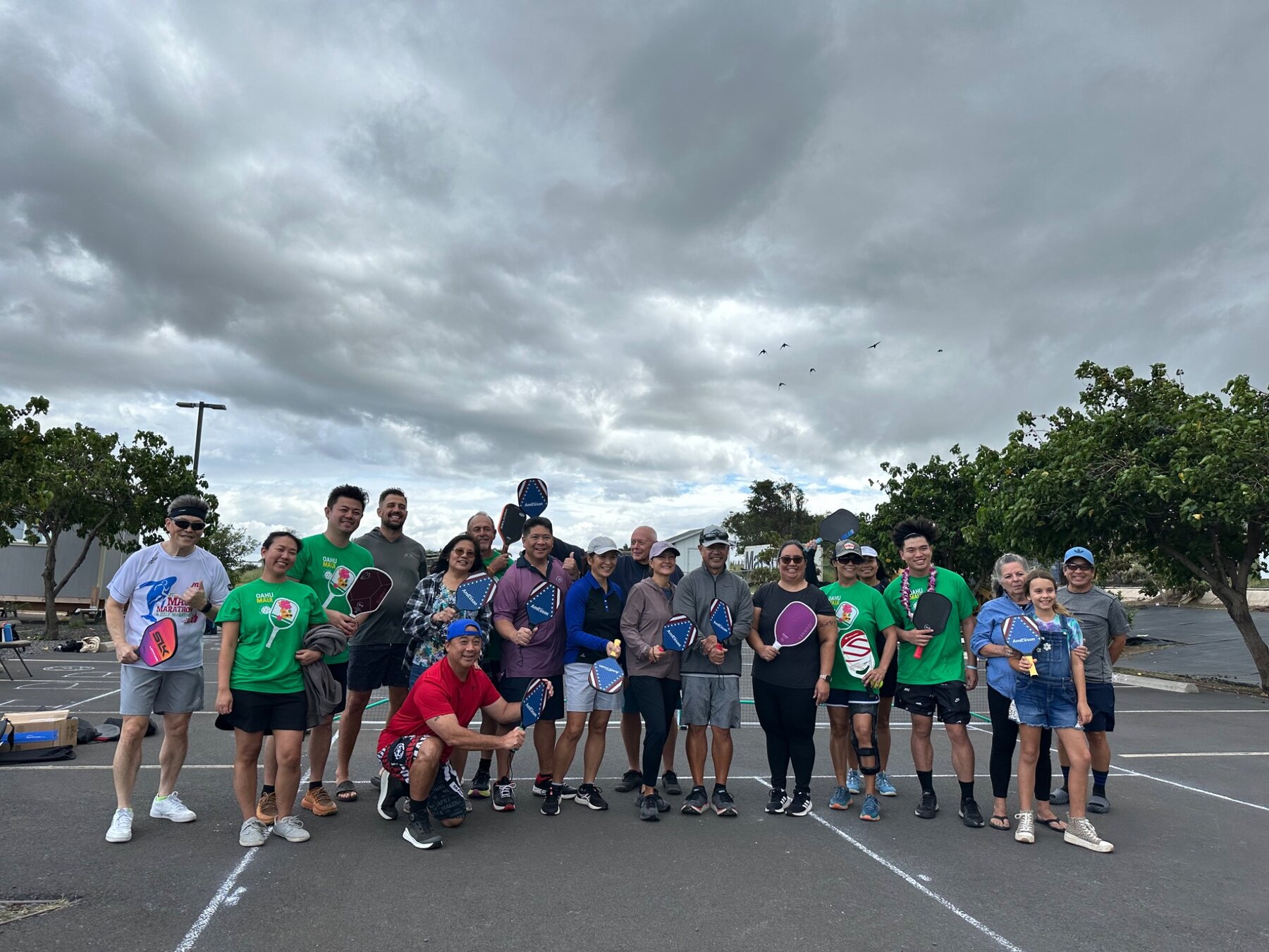 Players gathered at an outdoor community pickleball event in Hawaii