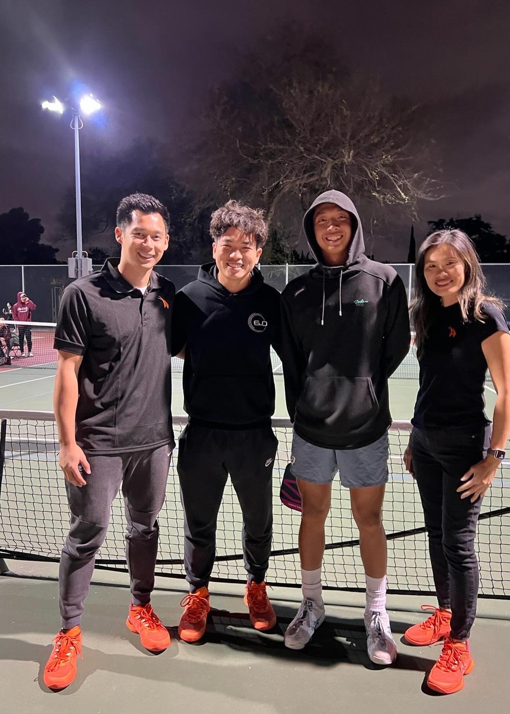 Eric Ng with athletes and members of the NGSG community